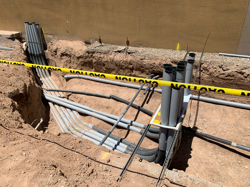electrical conduits behind caution tape