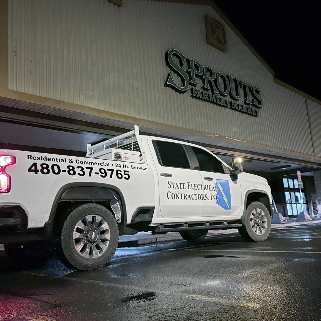 Commercial-Electricians-Phoenix-AZ State Electrical Contractors service truck outside Sprouts Farmers Market during nighttime commercial electrical service in the Phoenix, Arizona area.