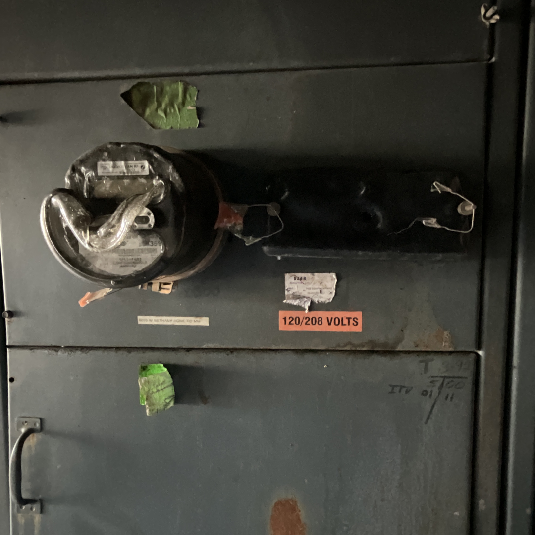 electrical-fire Commercial electrical fire damage on a 120/208-volt meter and service panel requiring licensed electrician inspection, repair, and code-safe replacement