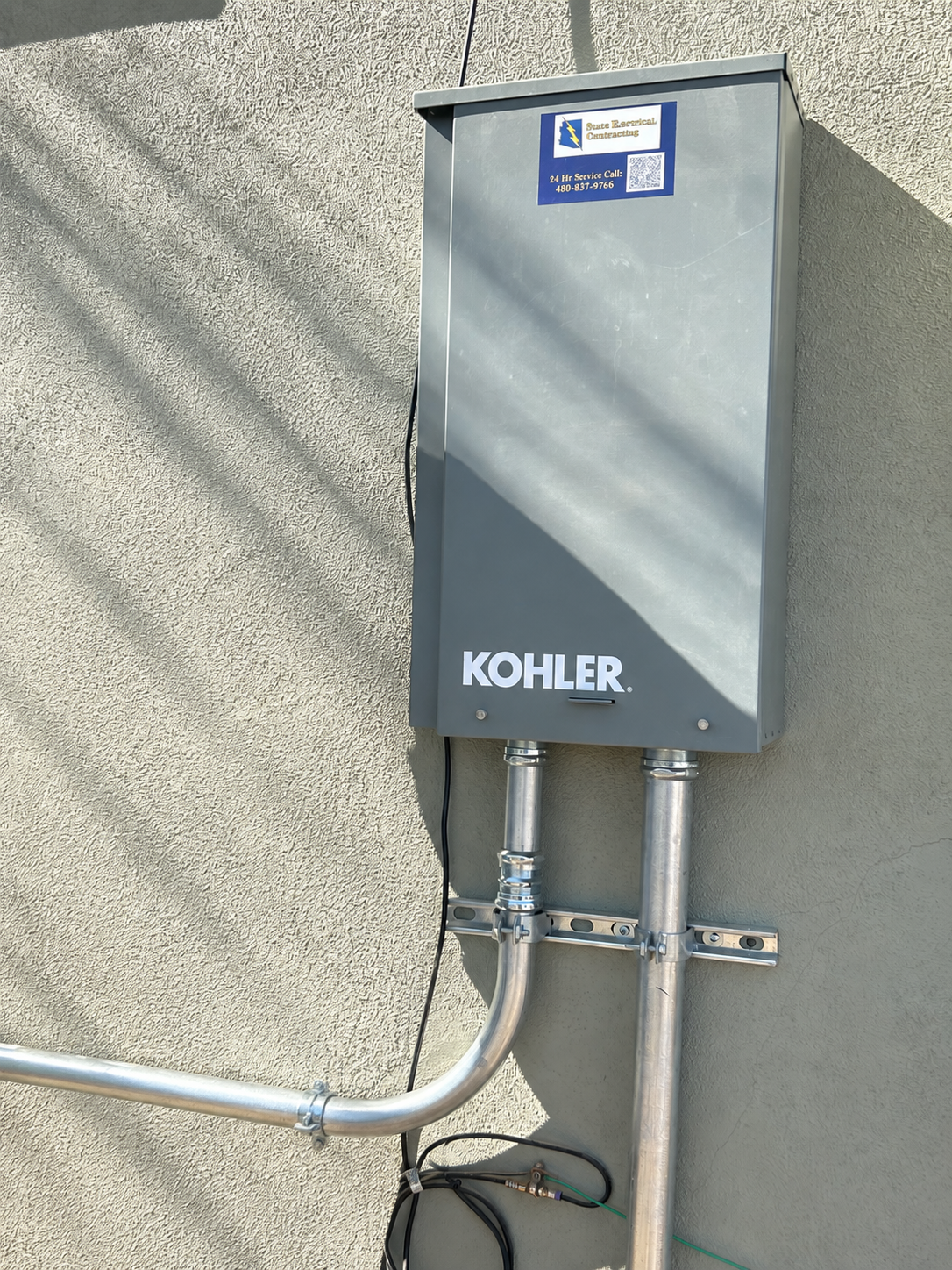 Kohler transfer cabinet against stucco wall Kohler transfer cabinet against stucco wall